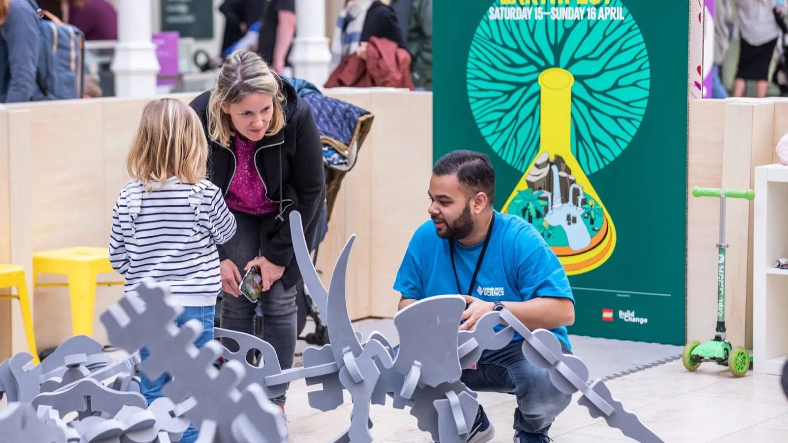 A family engaging with a hands-on science exhibit.